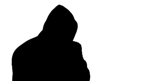 muscular silhouette of man wearing hood