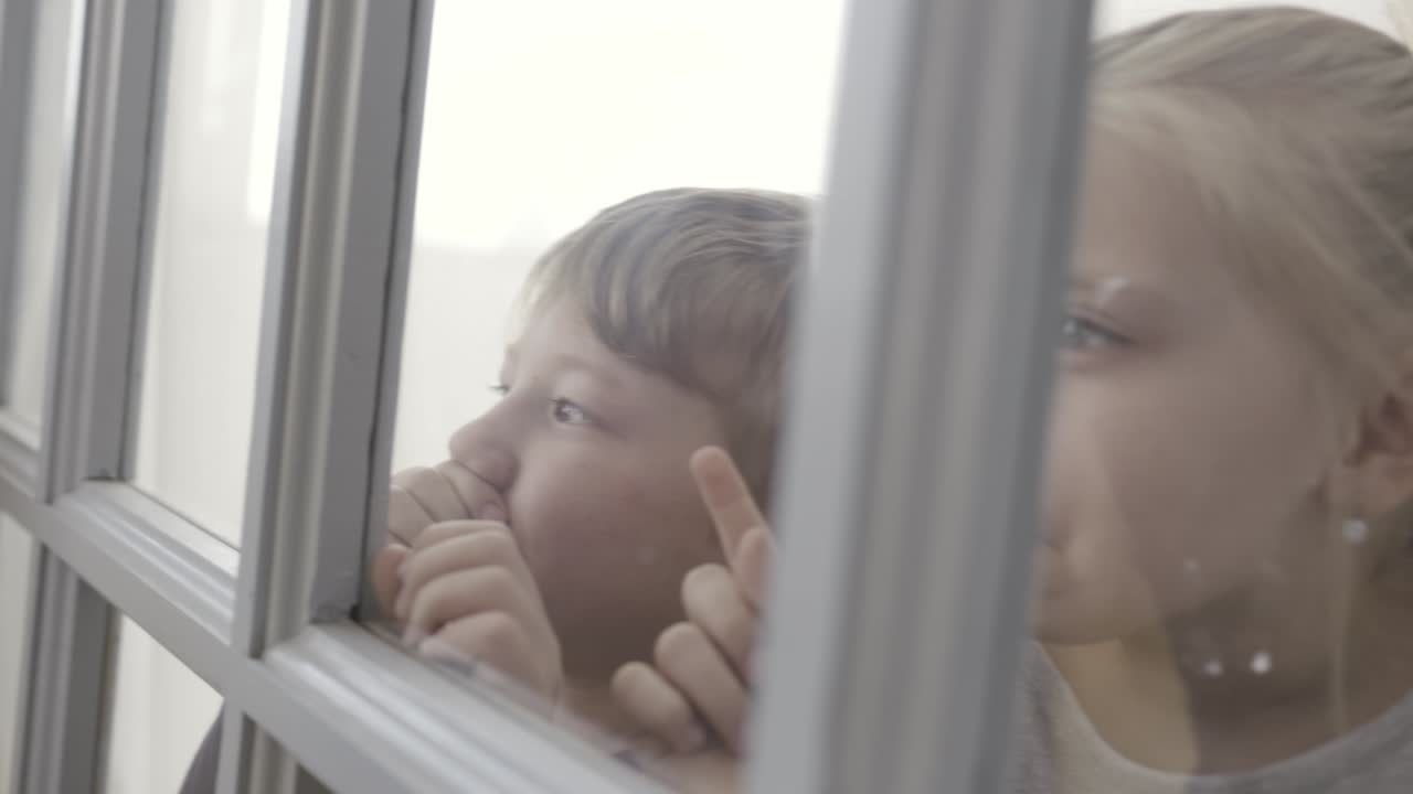 Children Looking Out Window