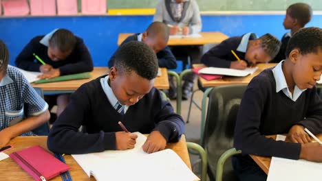 schoolkids studying in the classroom 4k