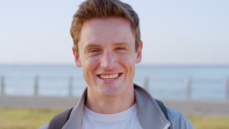 face portrait, smile and man on beach for travel