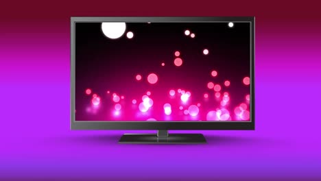 Flat-screen-TV-with-glowing-marbles-on-its-screen