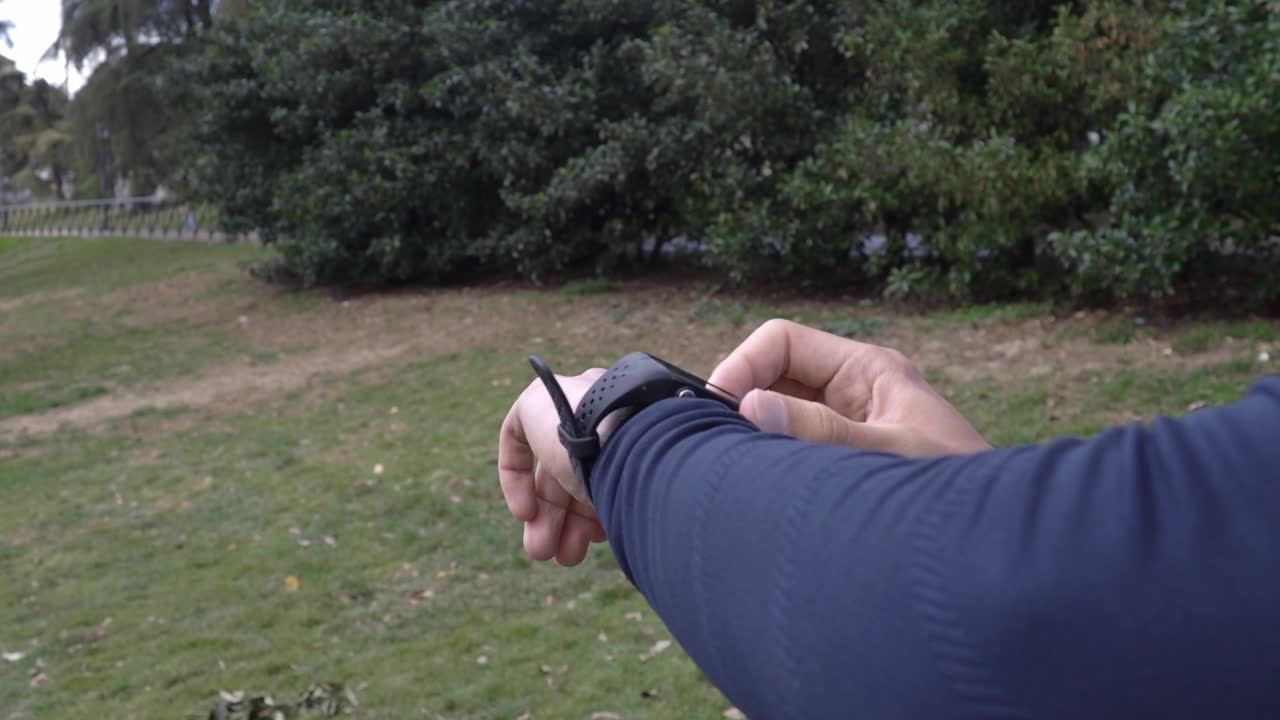 Man using smartwatch for workout equipment app technology monitor active gadget tech.