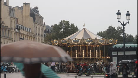 city street with carousel and people