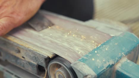 Sharpening-wood-chisel-blade-Sparks-Slow-motion