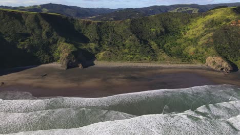 Amazing-aerial-view-of-Te-Henga-Beach,-scenic-and-leisure-spot-famous-for-wildeness-and-volcanic-coastal-scenery