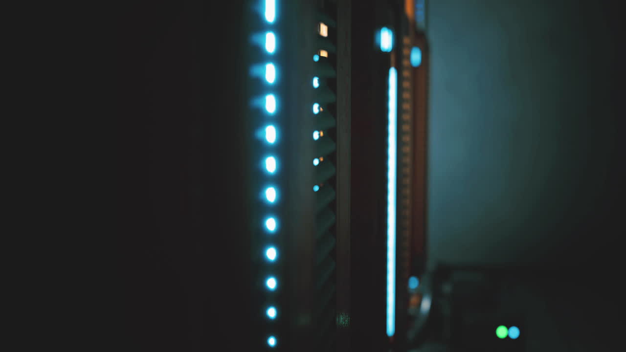 Servers illuminated with blue lights in a dark data center during nighttime