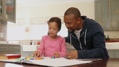 father and daughter playing with colour crayons 4k