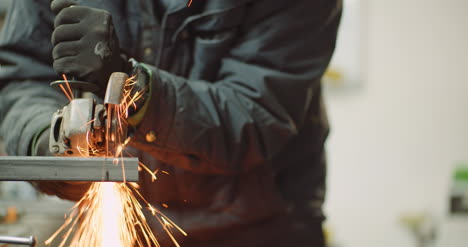 falling spark during cutting metal with angle grinder