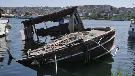 sunken wooden boat in a harbor