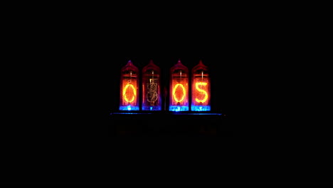 nixie tube digital display reads 0:04 then cycles through all numerals and ends at 0:05