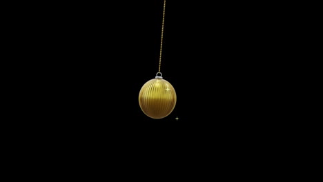 gold christmas bauble swinging with gold stars on black background