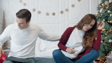 handsome business man saying sorry to woman in luxury house