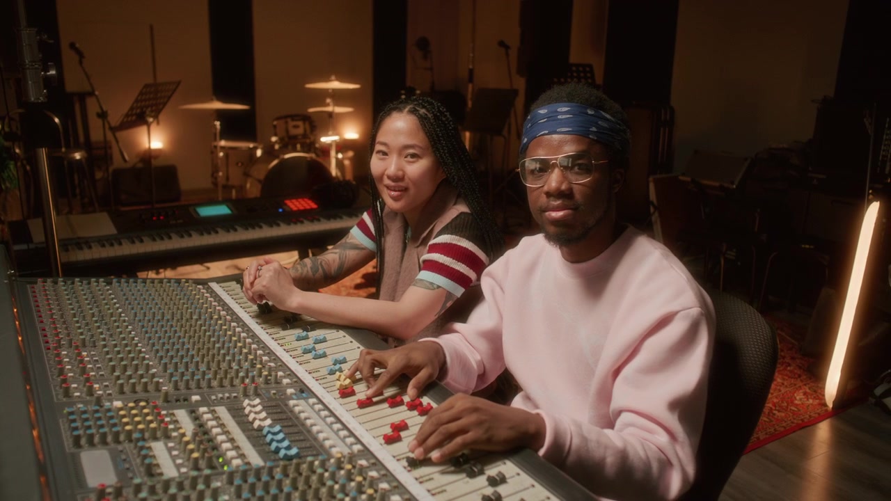 Portrait of Diverse Musicians Working Together in Audio Recording Studio