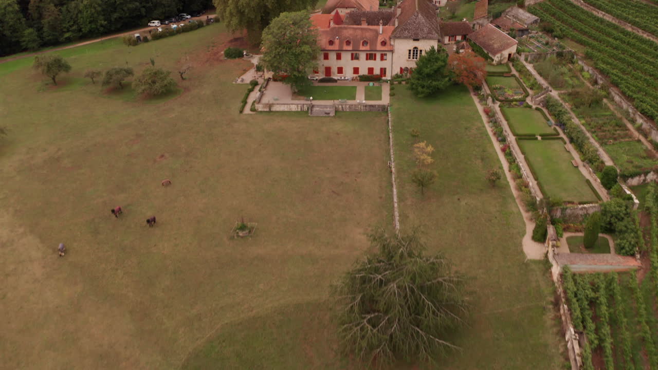 Aerial reveal of beautiful old building in Swiss countryside