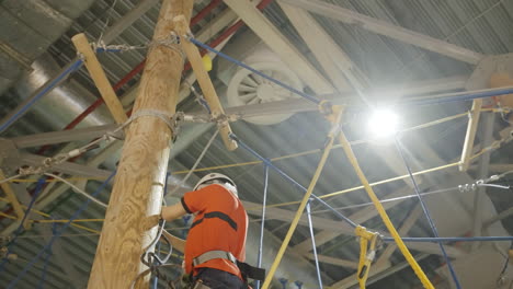 kid climbing in an indoor adventure park