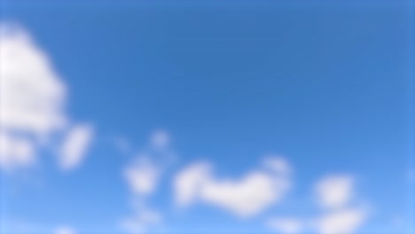 una secuencia de nubes borrosas que se mueven a través de un cielo azul brillante, creando una atmósfera serena y soñadora