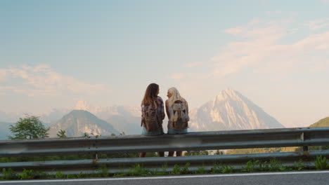 two women enjoying a mountain view