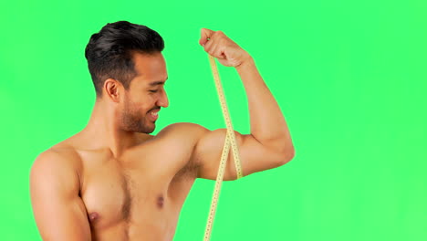 Happy-man,-tape-measure-and-bicep-on-green-screen