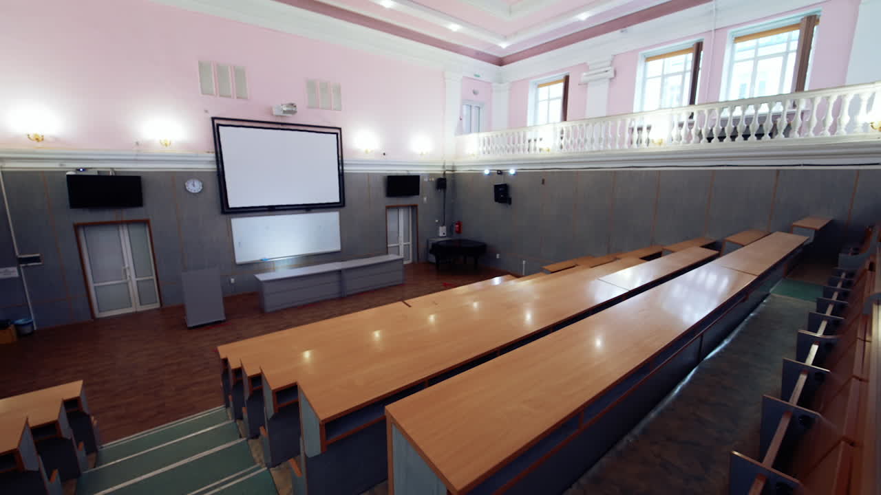 Empty big modern education room. Conference lecture room with empty audience.