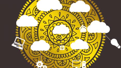 Animation-of-clouds-and-digital-icons-over-graphic-yellow-mandala