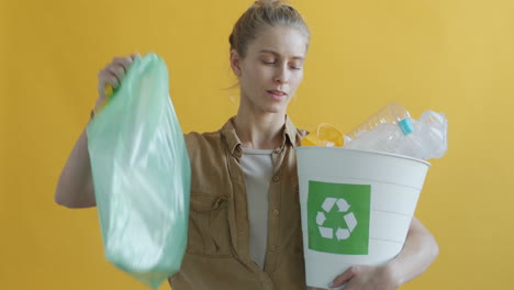 Woman Recycling Plastic Bottles and Bags