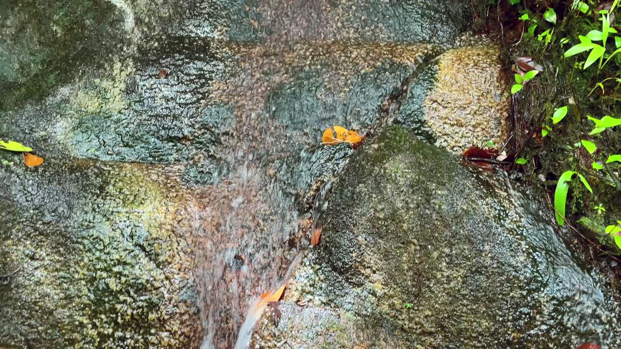 Mahe Seychelles water fallng from rock after heavy rain