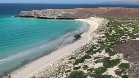 fixed shot of playa escamilla guerrero with teal waves