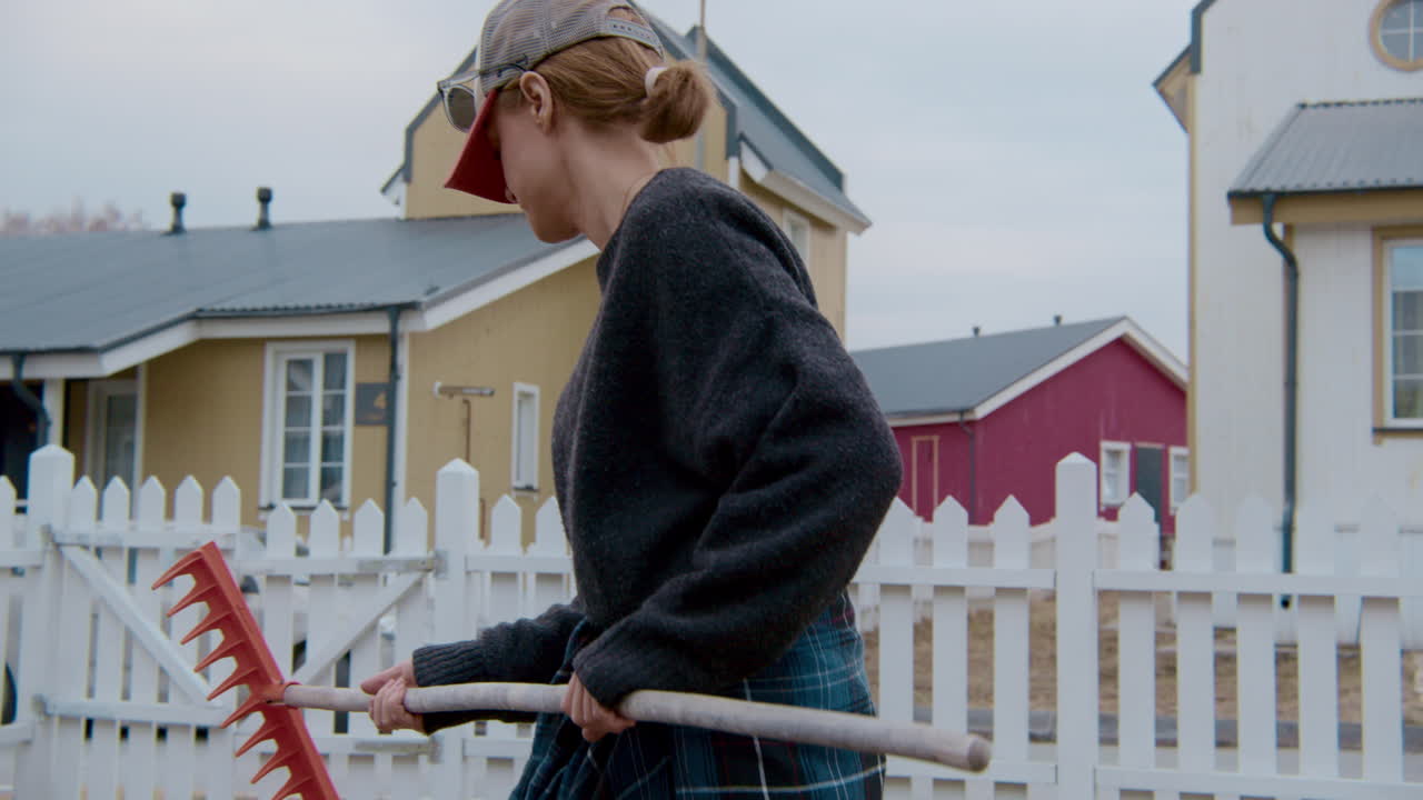 Woman Gardening in a Residential Yard