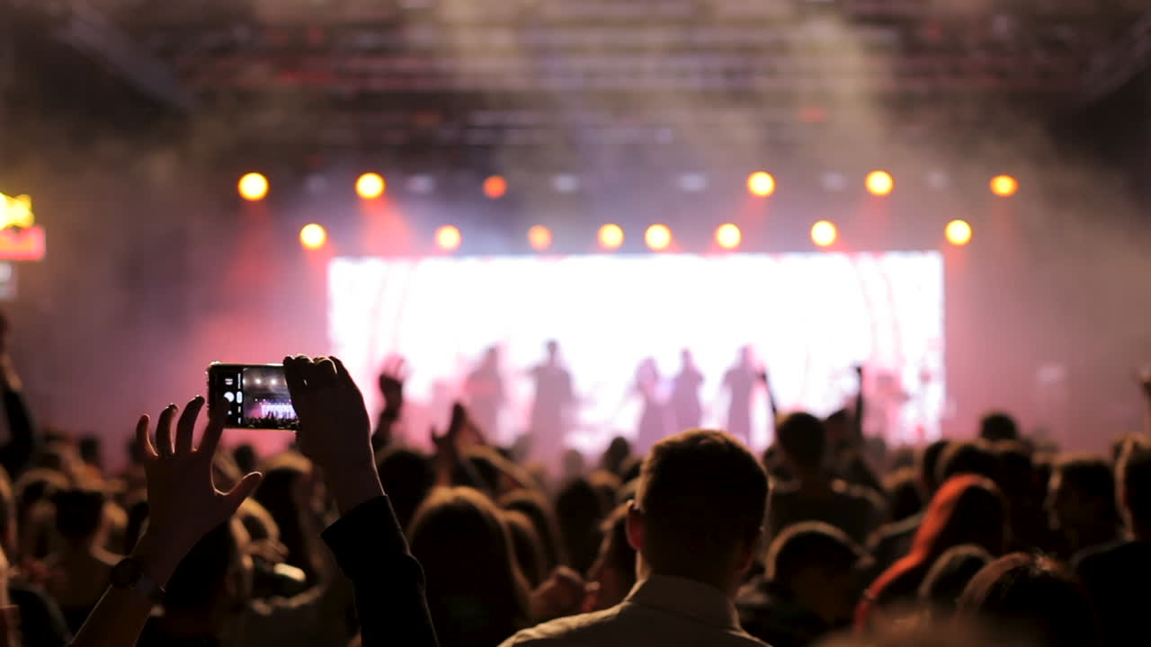 Concert crowd with people taking photos