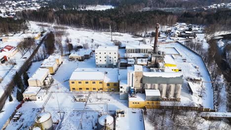 drone view industrial building of electric utility company in city of silute in winters, lithuania