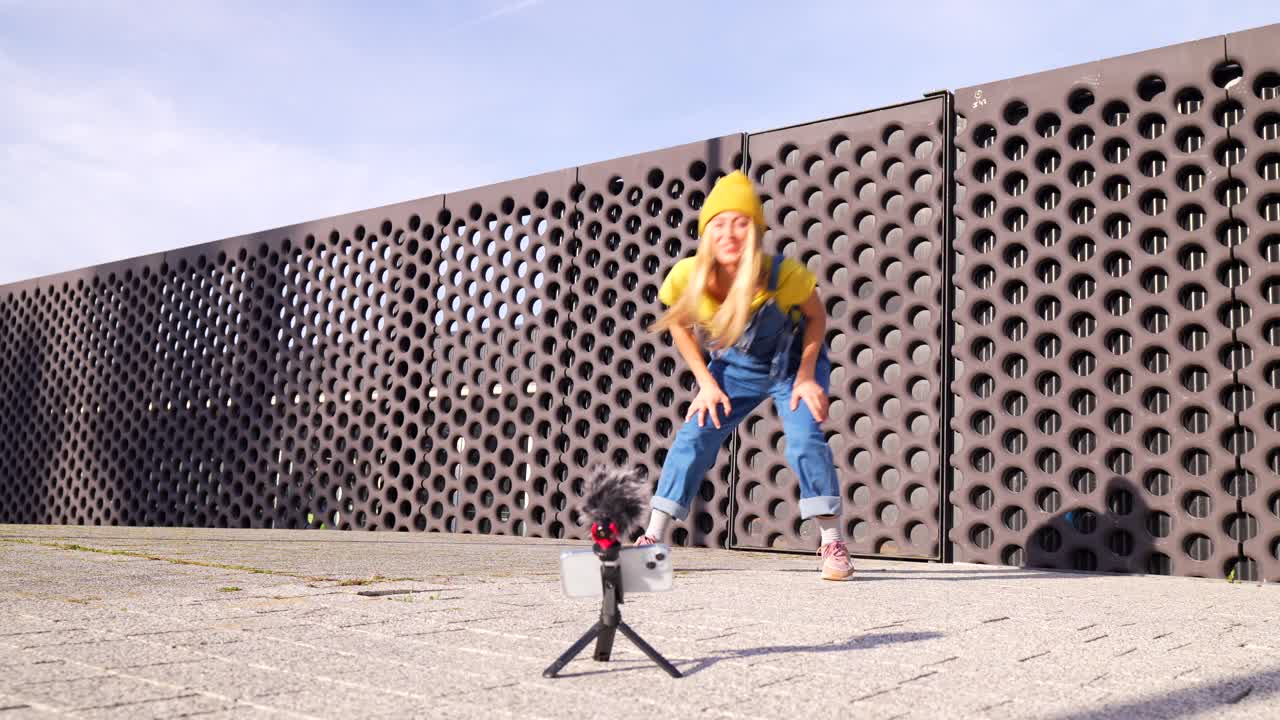 Woman Dancing and Vlogging Outdoors