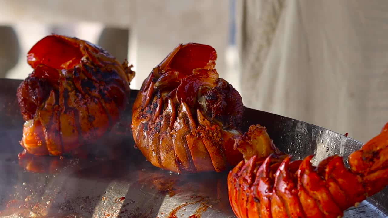 Chef grilling fresh seafood at Cedros Island market stall, sizzling and aromatic cooking