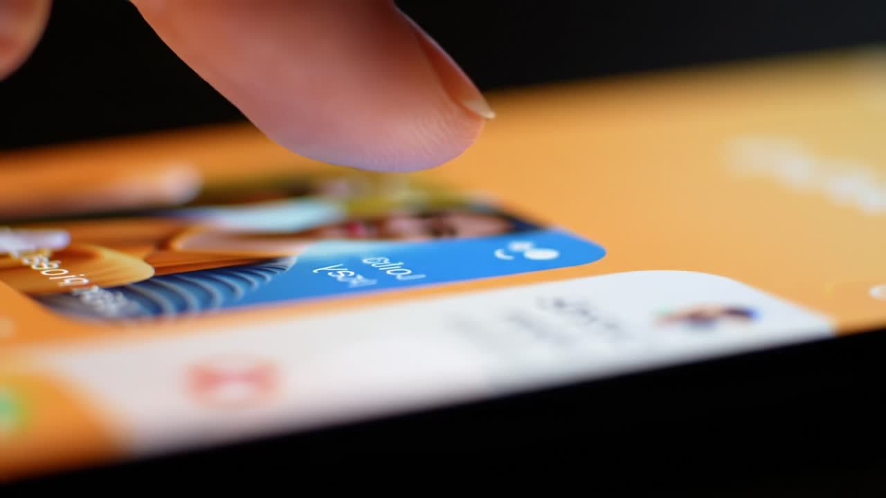 A Close-Up Perspective of a Finger Interacting with a Touchscreen Display, Highlighting the Engagement with User Interface Elements and Colorful Visuals