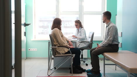 gynecologist talking to her patient in the consultation