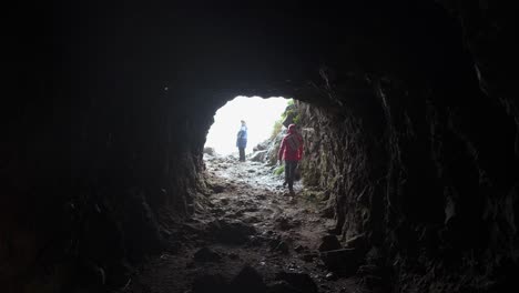 exploring a cave tunnel