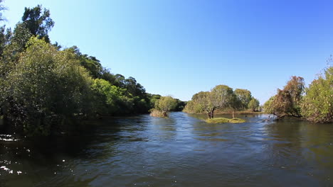 the chobe rapids as viewed from a aluminium river boat in summer as the water was low