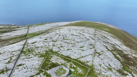 ireland epic locations stone landscape flying over ancient ring fort to black head lighthouse wild atlantic way clare ireland