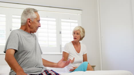 Mature-couple-quarrelling-on-bed