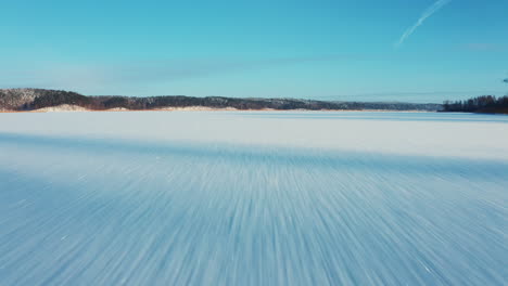 Fast-flying-drone-camera-view-over-frozen-lake