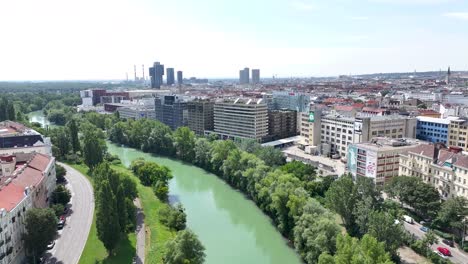 drone flyover the river in vienna city to down town