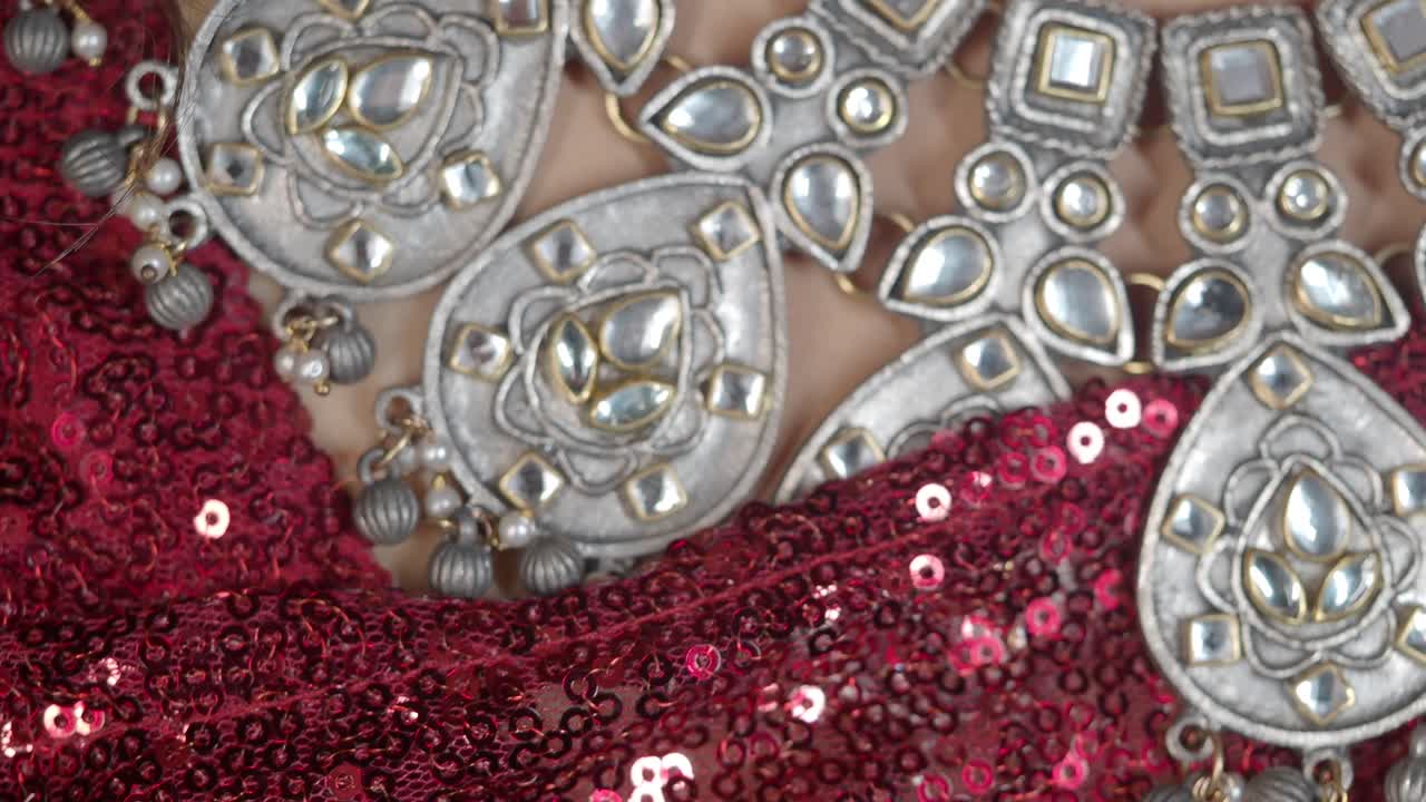 Close-up of Jewelry and Sequined Fabric