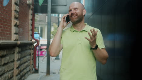 man talking on the phone in a city alley