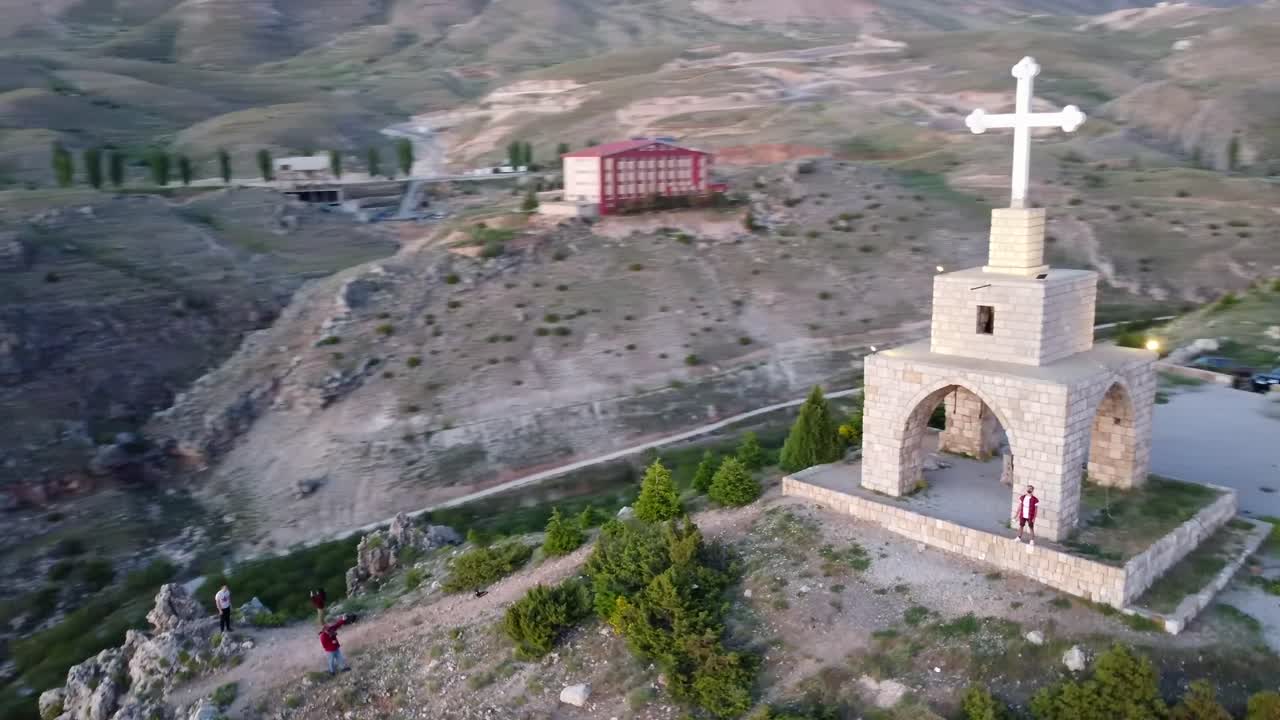 Aerial View of a Stone Church on a Mountaintop at Sunset