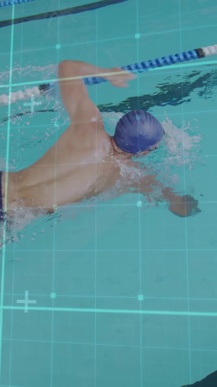 Vertical video: Male swimmer starting crawl after glide in lane, grid overlay tracking sports form