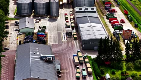 agricultural plant bustling with activity, shot from above on a sunny day