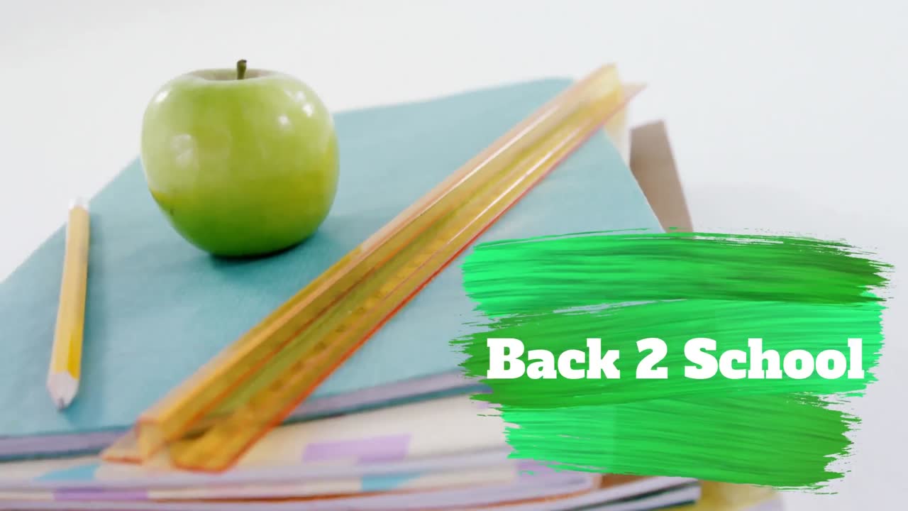 Back to school text against stack of books