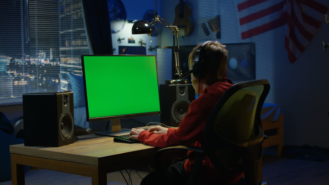 Boy Gaming in His Bedroom at Night