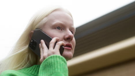 albino woman walking on the street