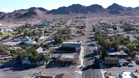 aerial cityscape of a small town in the middle of desert on a hot day