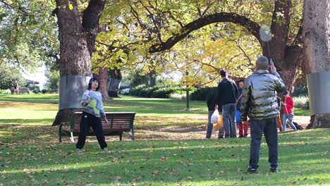 people playing badminton in a park